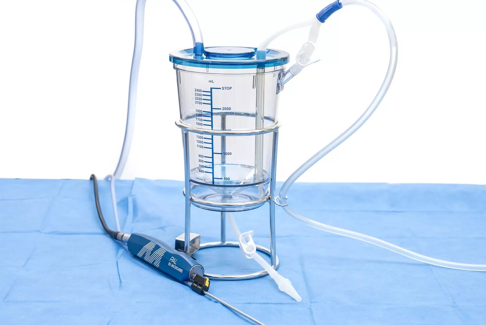 A PAL motorized handpiece and suction canister placed on surgical drapes